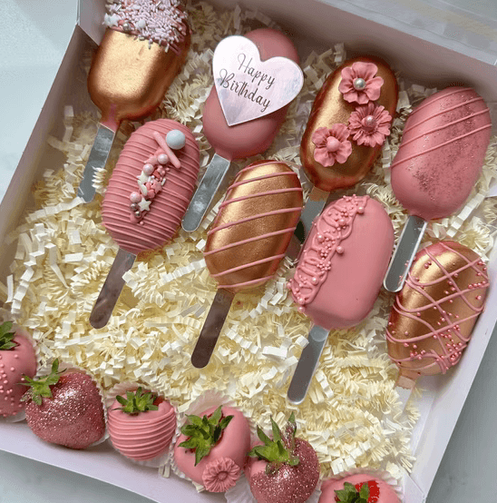 Handcrafted cake pops and chocolate-covered strawberries